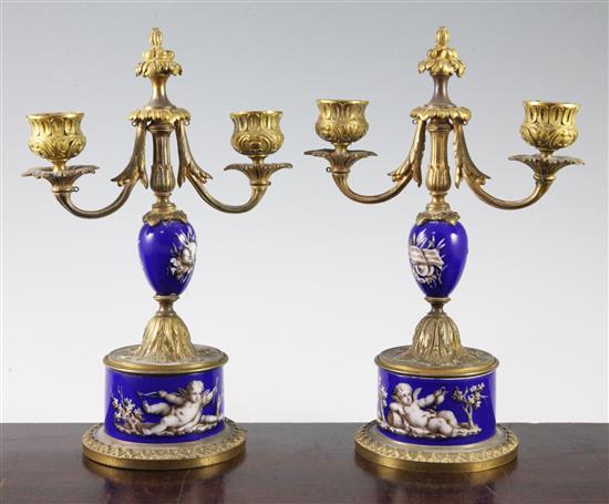 A pair of 19th century French ormolu mounted porcelain candelabra, 10in.